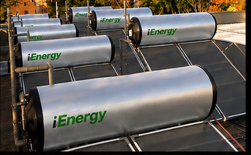 iEnergy solar thermal collectors with storage cylinders on a rooftop